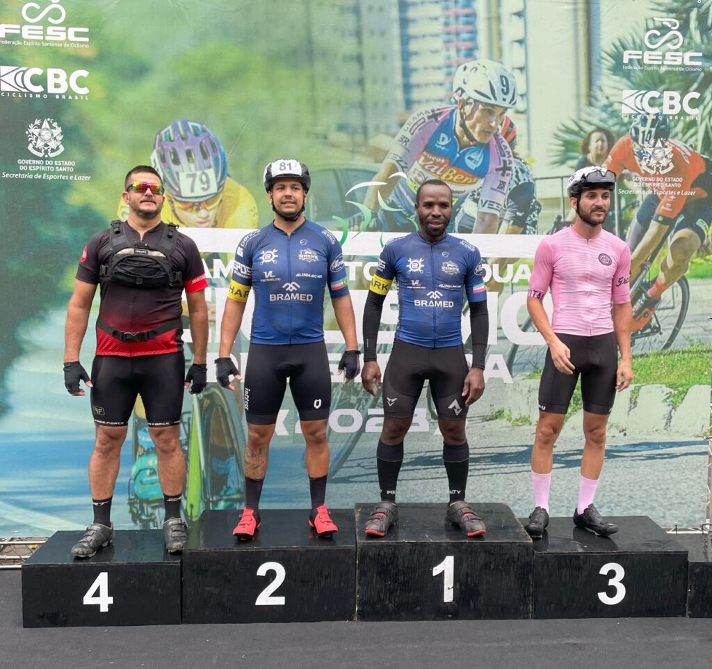 men's category podium with shark team member winning